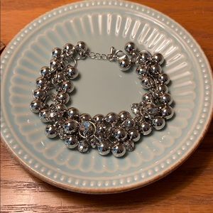 Silver bracelet with beads and rhinestones